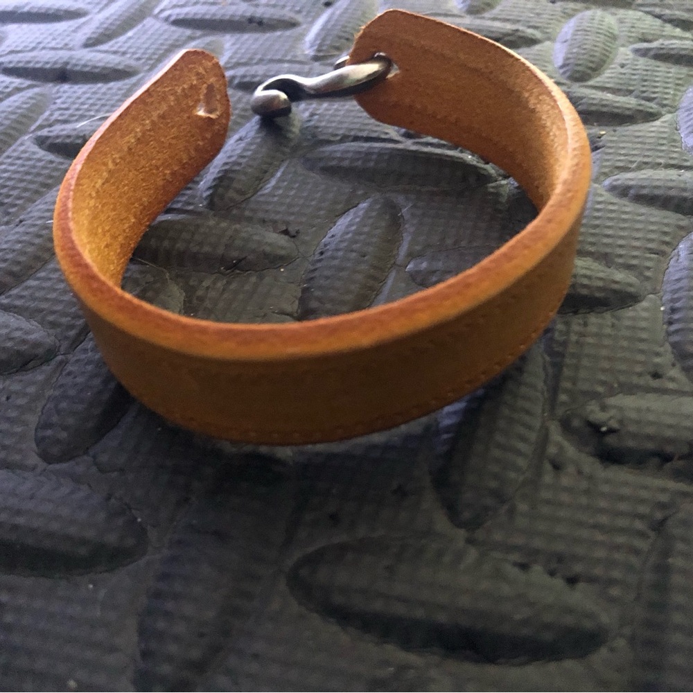 Unisex handmade thick rawhide bracelet. Hook closure, hand stitching